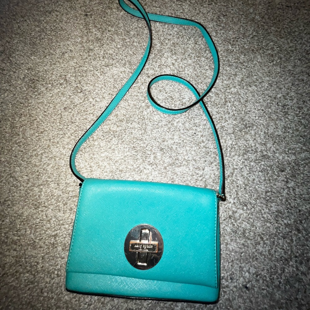 Kate Spade turquoise crossbody purse.